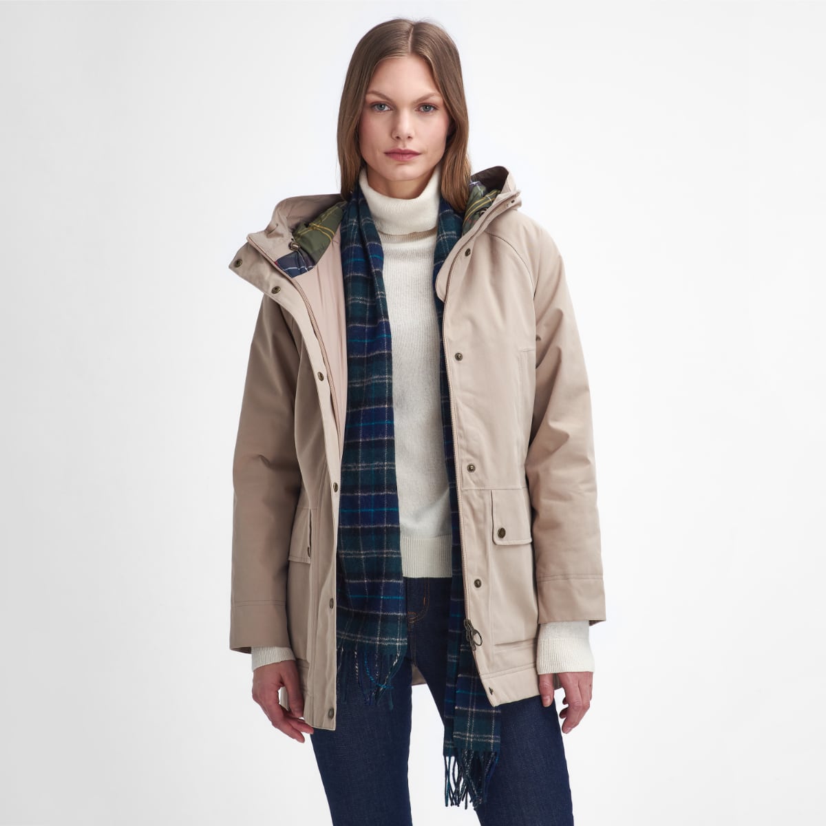 Barbour Winter Beadnell waterproof jacket in Sand Dune worn by a model with a cream knit sweater and plaid scarf