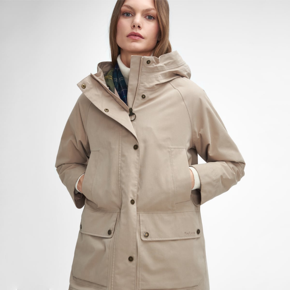 Close up of Barbour Winter Beadnell waterproof jacket in Sand Dune showing hooded collar front placket and pocket flaps
