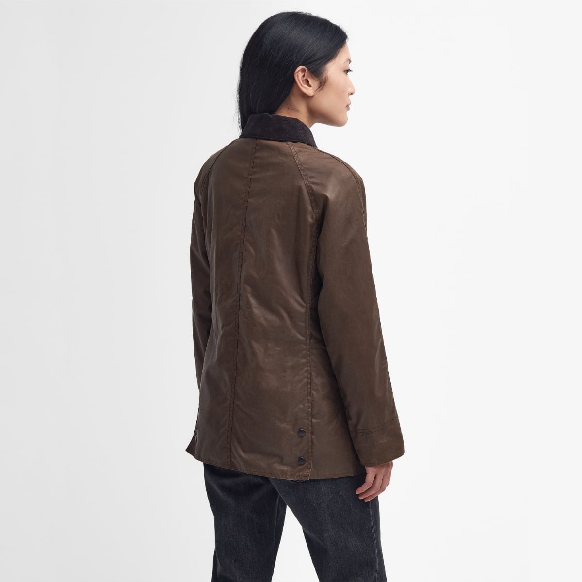 Rear view of Barbour Beadnell wax jacket in bark on model