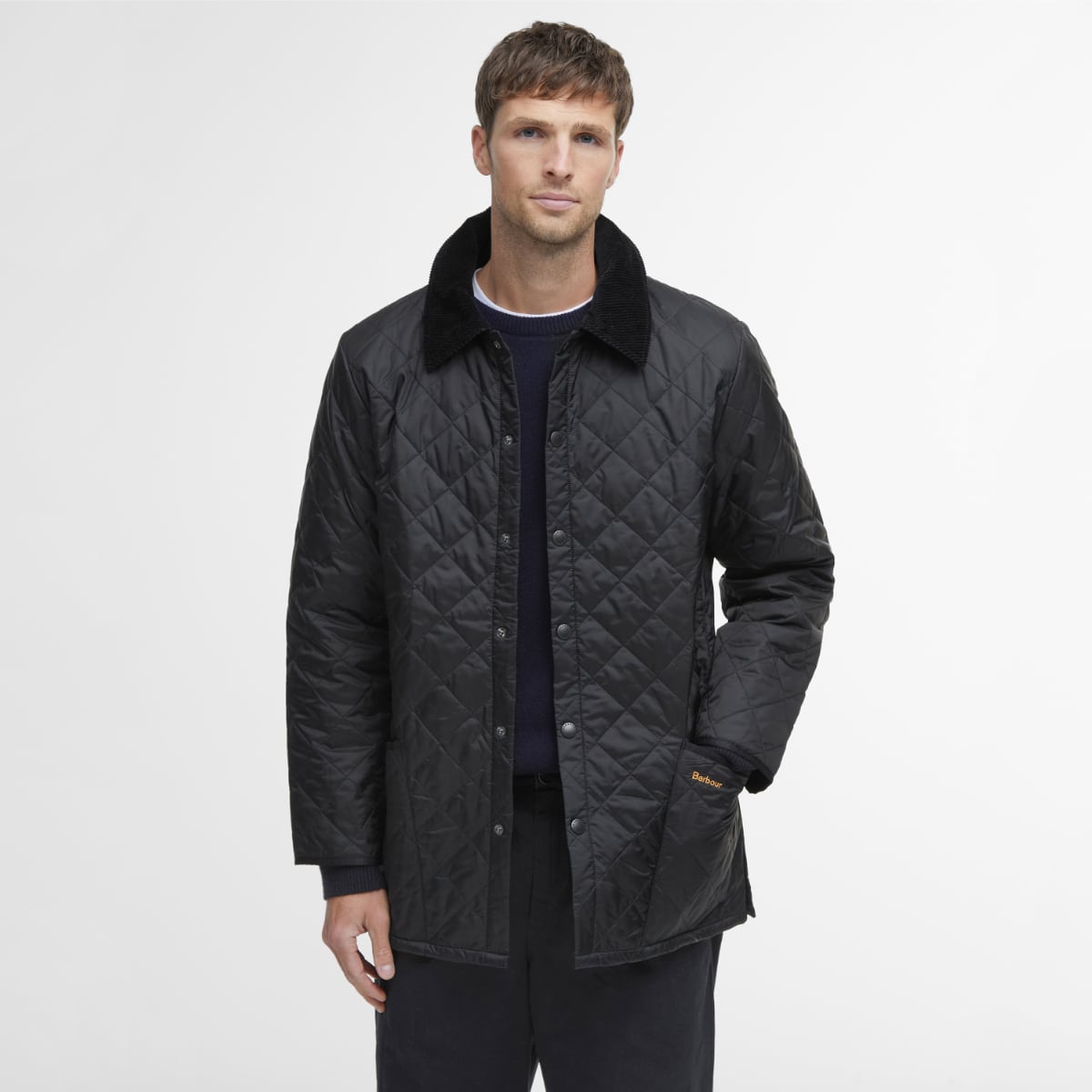 Front view of model wearing a Barbour Liddesdale Quilted Jacket in Black