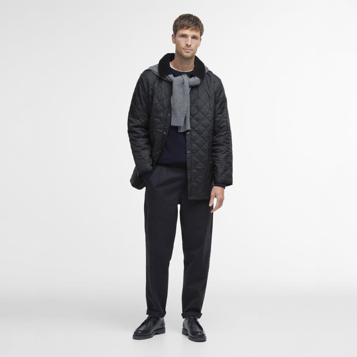Front view of model wearing a Barbour Liddesdale Quilted Jacket in Black full height