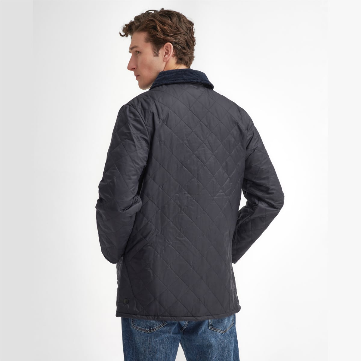 Rear view of model wearing a Barbour Liddesdale Quilted Jacket in Navy