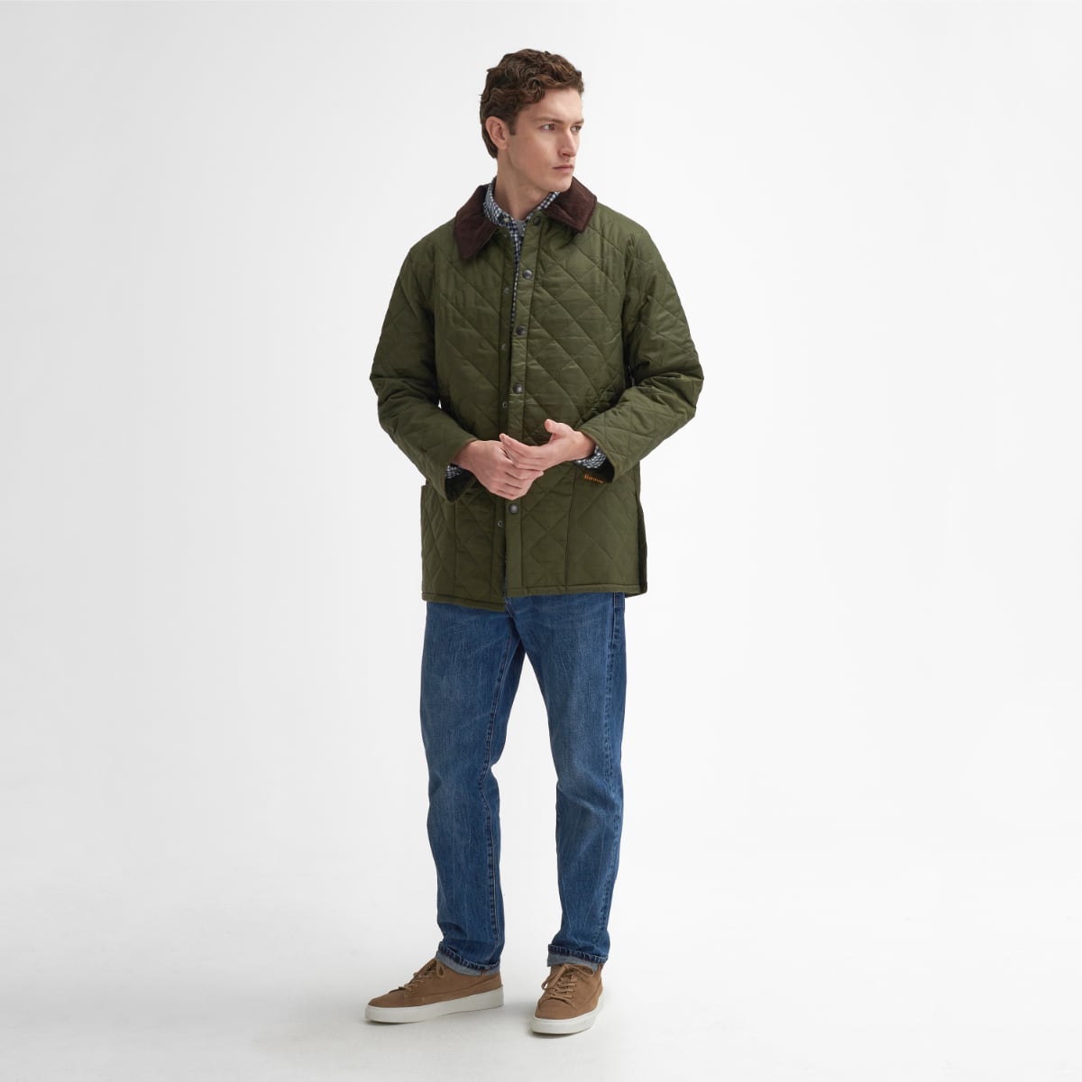 Front view of model wearing a Barbour Liddesdale Quilted Jacket in Olive full height