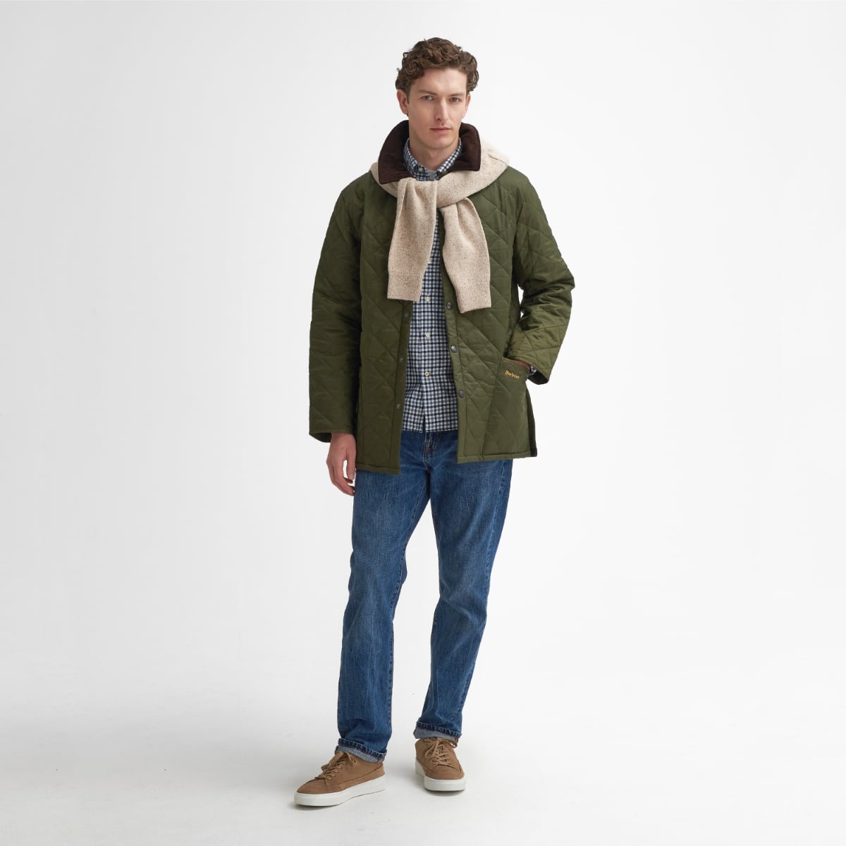 Front view of model wearing a Barbour Liddesdale Quilted Jacket in Olive with scarf