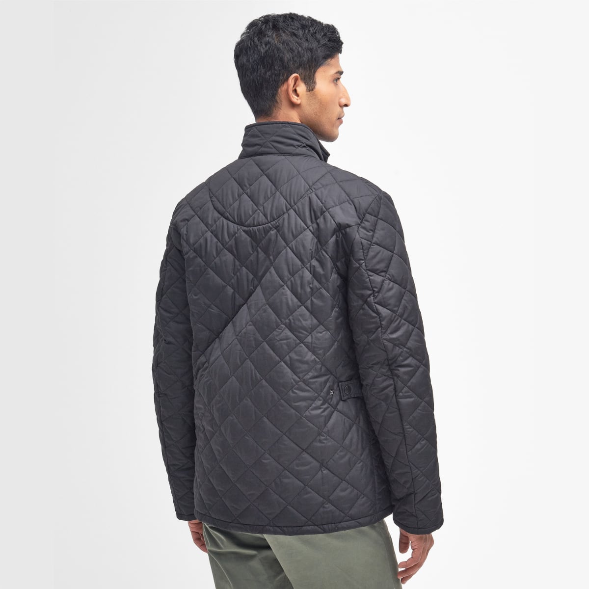 Rear view of Barbour Chelsea Sportsquilt in Black on model