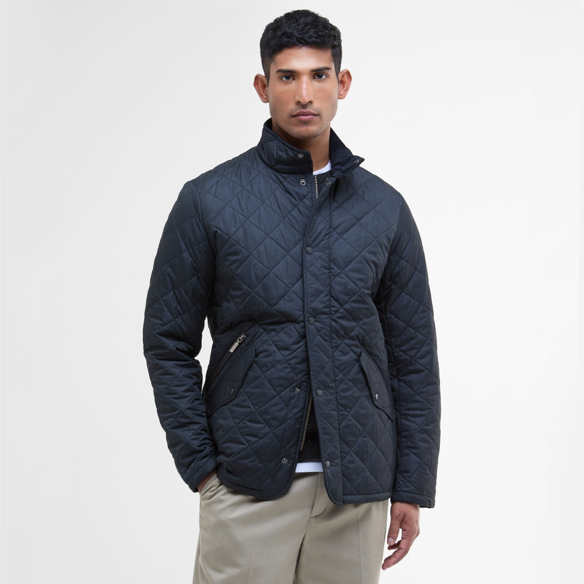 Front view of Barbour Chelsea Sportsquilt in navy on model