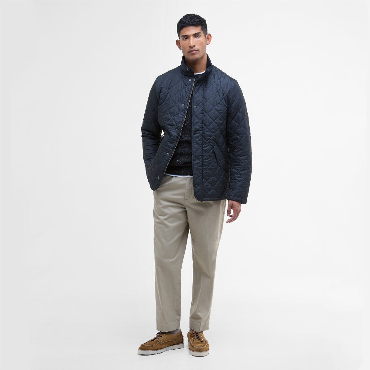 Rear view of Barbour Chelsea Sportsquilt in navy on model full height