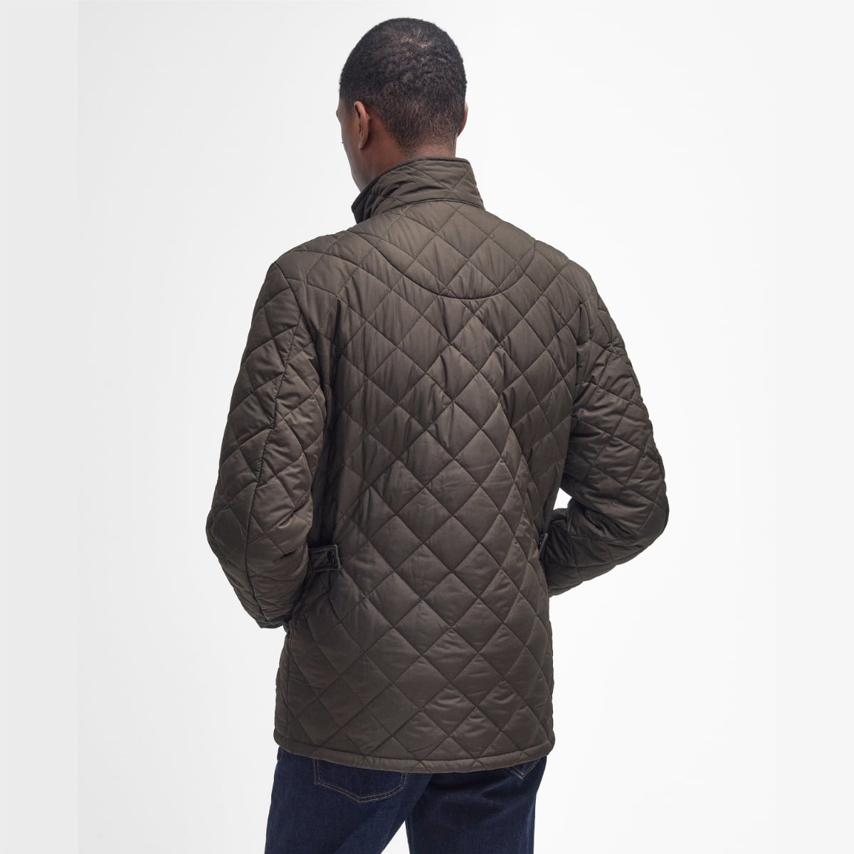 Rear view of Barbour Chelsea Sportsquilt in olive on model