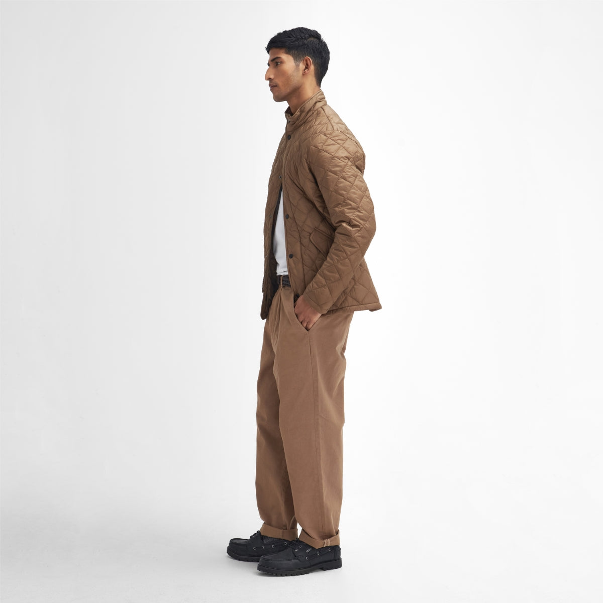 Side profile of Barbour Flyweight Chelsea Quilted Jacket in Light Sandstone on model