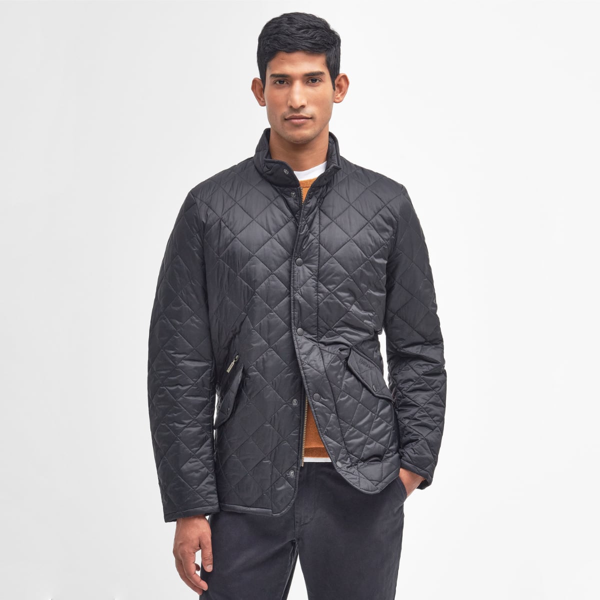 Front view of Barbour Flyweight Chelsea Quilted Jacket in black on model