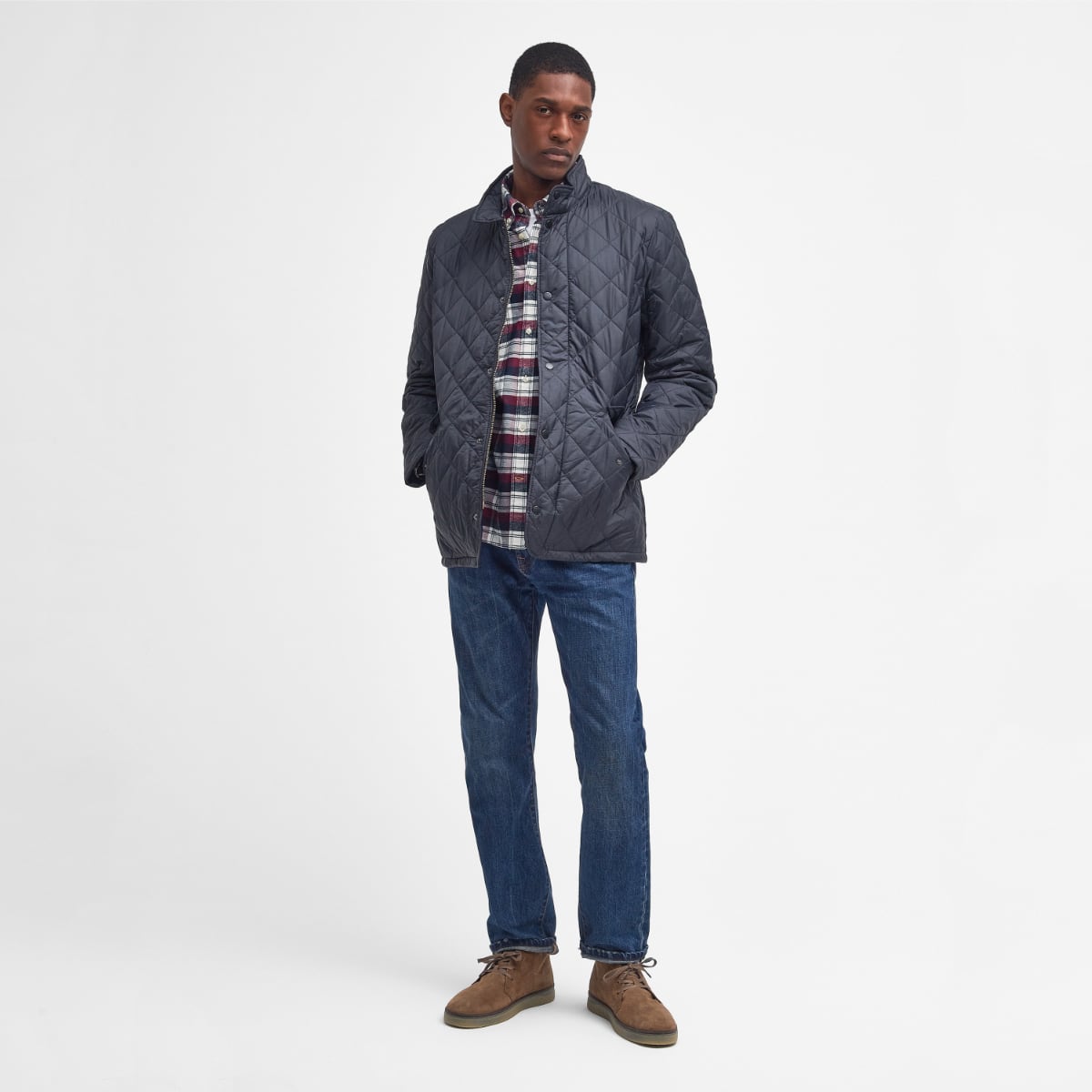 Front view of Barbour Flyweight Chelsea Quilted Jacket in Navy on model full height