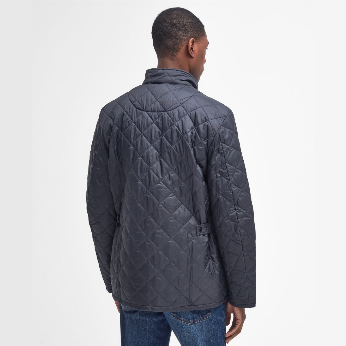 Rear view of Barbour Flyweight Chelsea Quilted Jacket in Navy on model