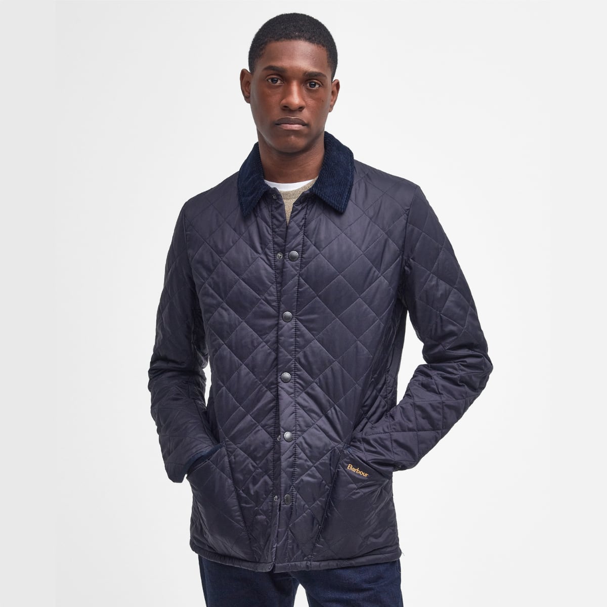 Front view of Barbour Heritage Liddesdale quilted men’s jacket in navy on model