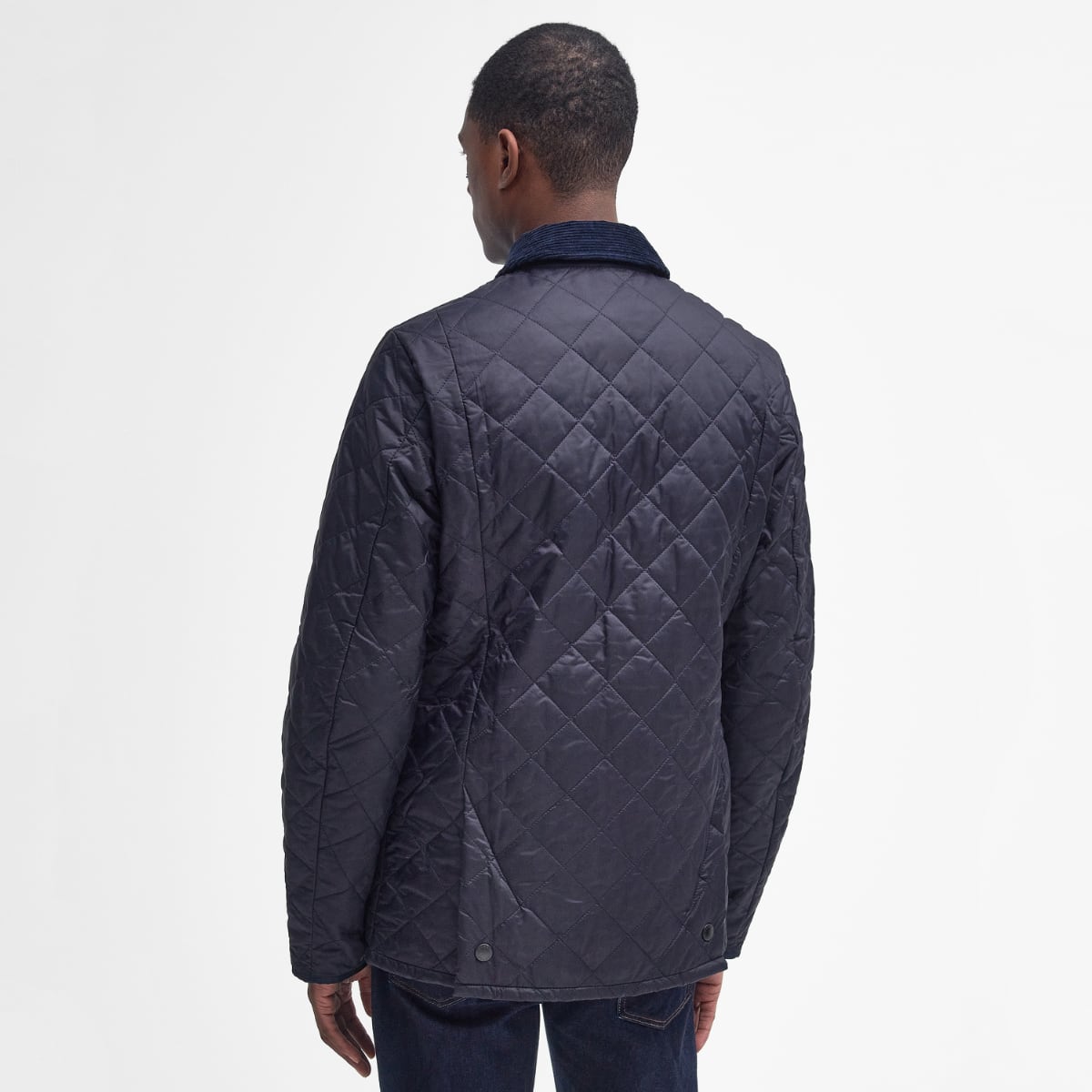 Rear view of Barbour Heritage Liddesdale quilted men’s jacket in navy on model