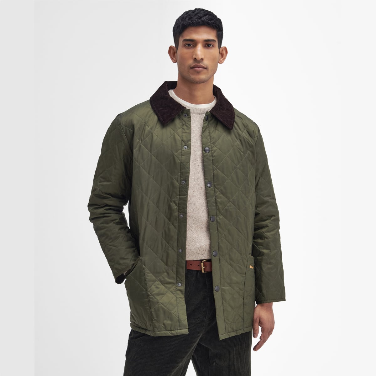 Front view of Barbour Heritage Liddesdale quilted men’s jacket in olive on model