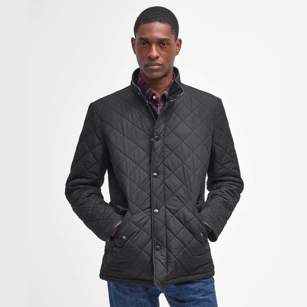 Front view of Barbour Powell Quilted Jacket in black on model