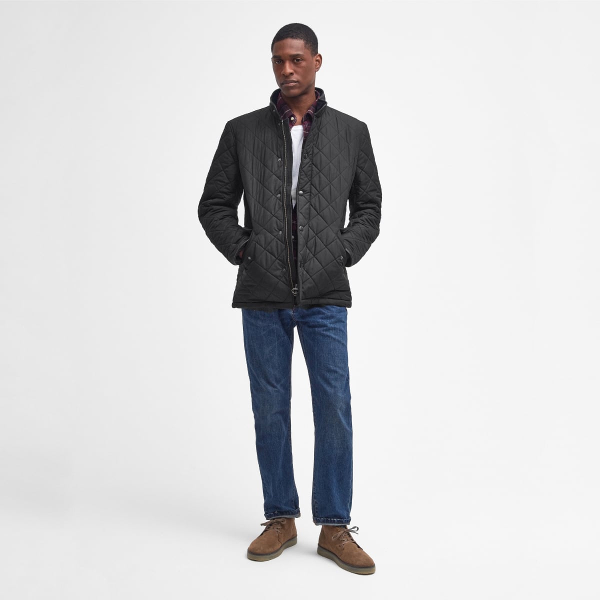 Front view of Barbour Powell Quilted Jacket in black on model full height