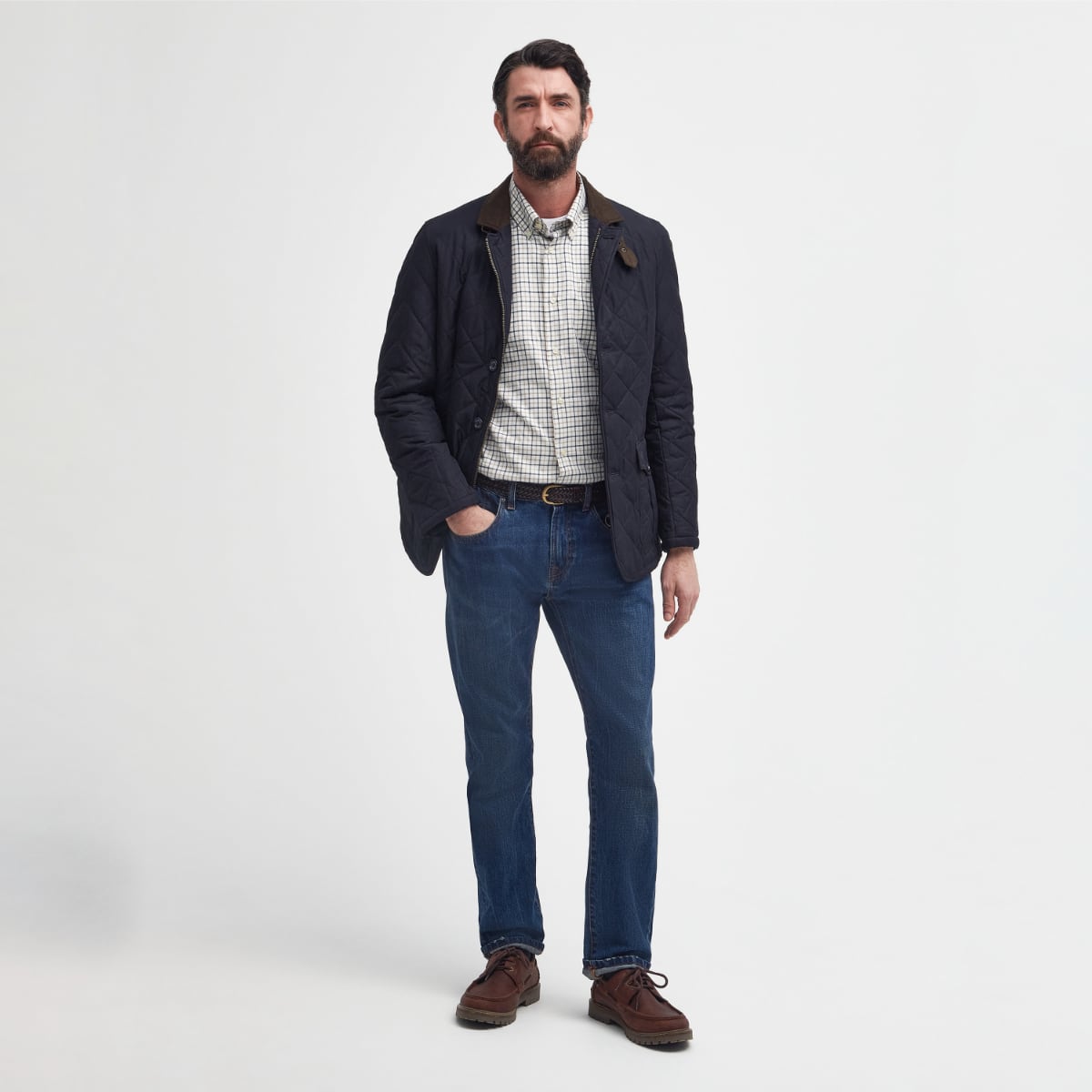 Man wearing Barbour Quilted Lutz Jacket full height photo