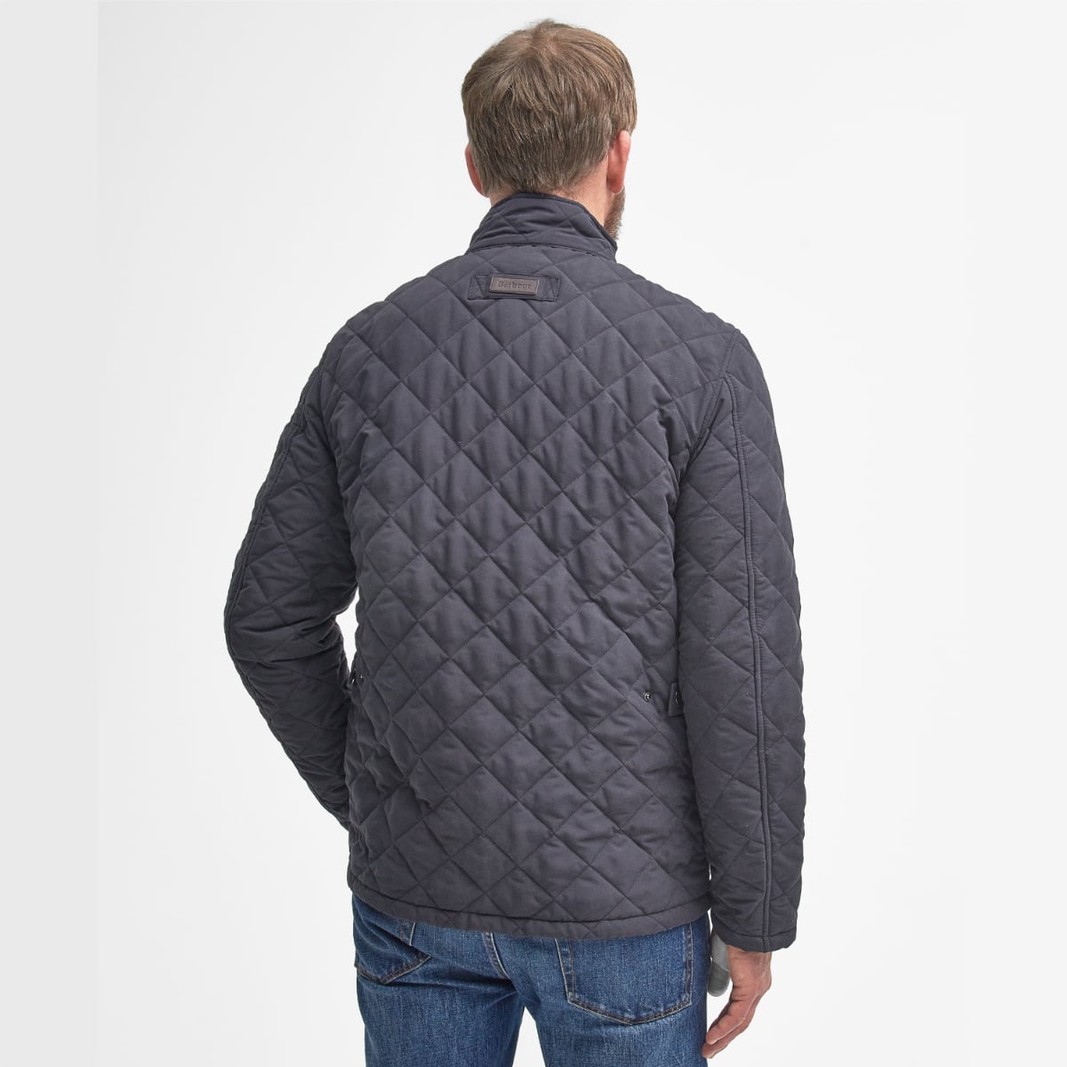 Model wearing Barbour Shoveler Jacket in navy - rear view