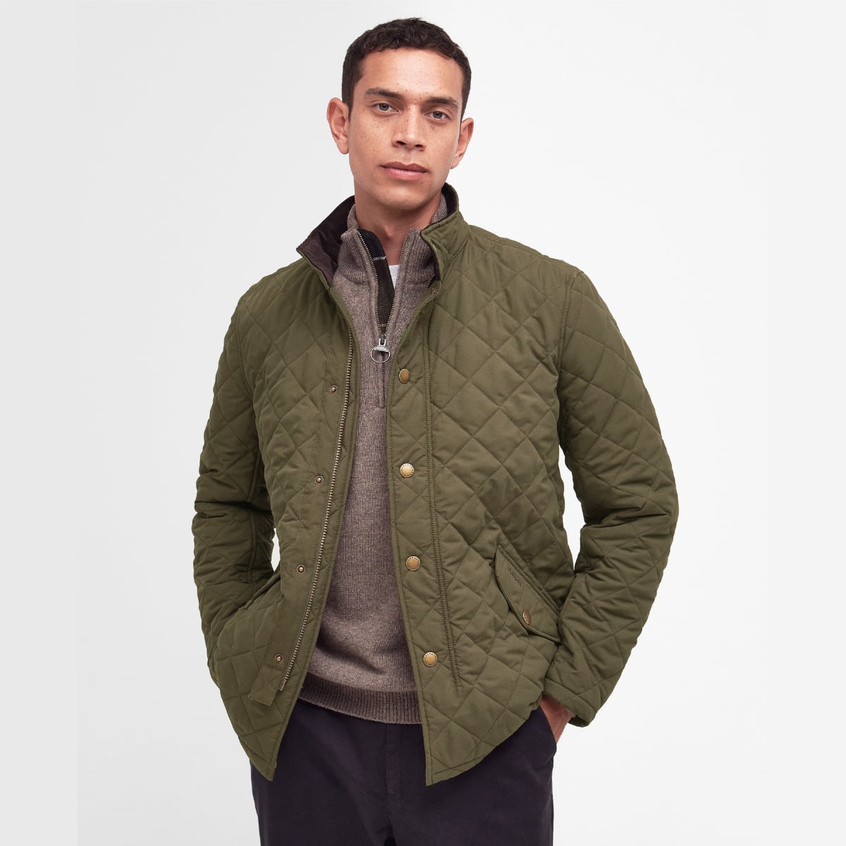 Model wearing Barbour Shoveler Jacket in Army Green