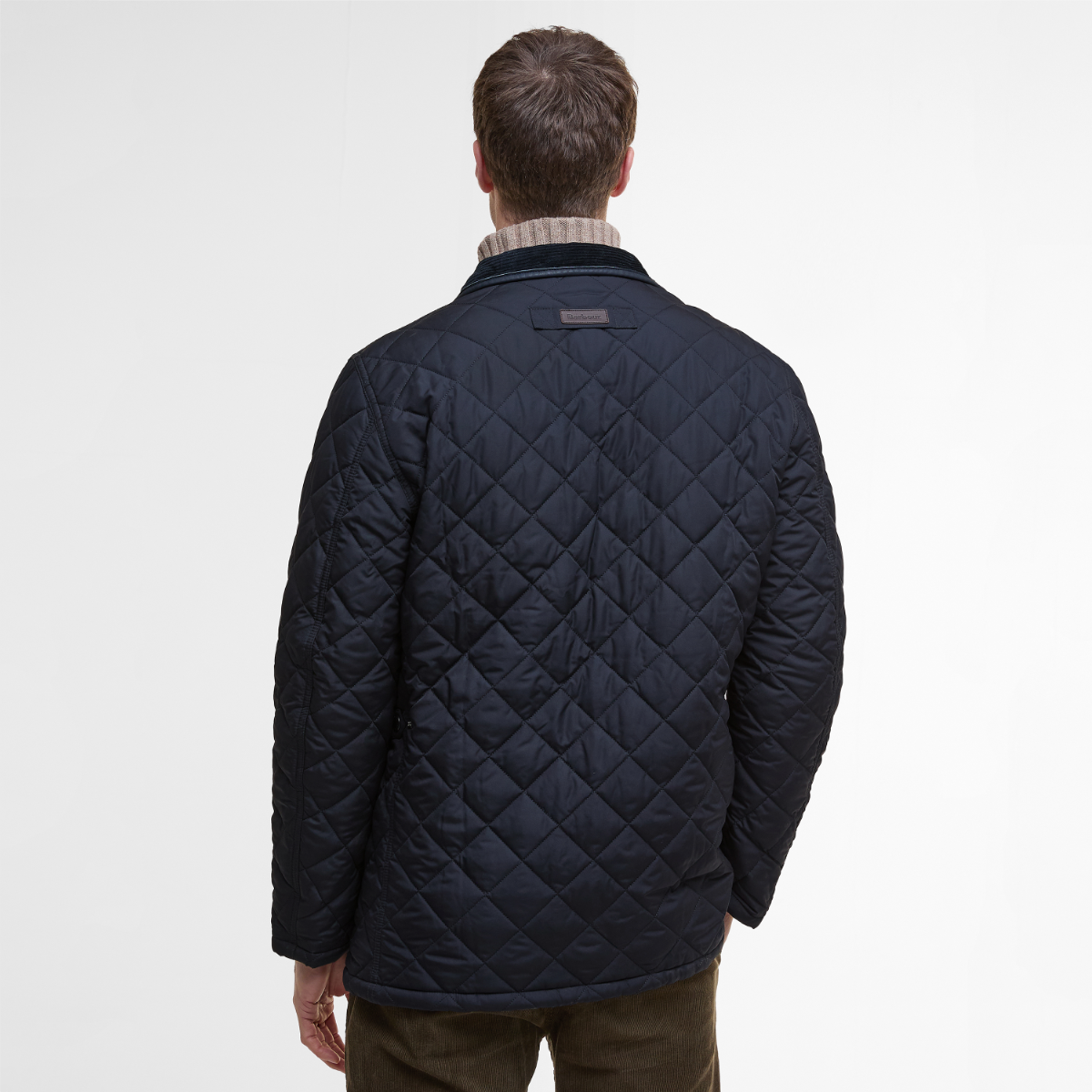 Barbour Devon Quilted Men’s Jacket in Navy – rear view on model