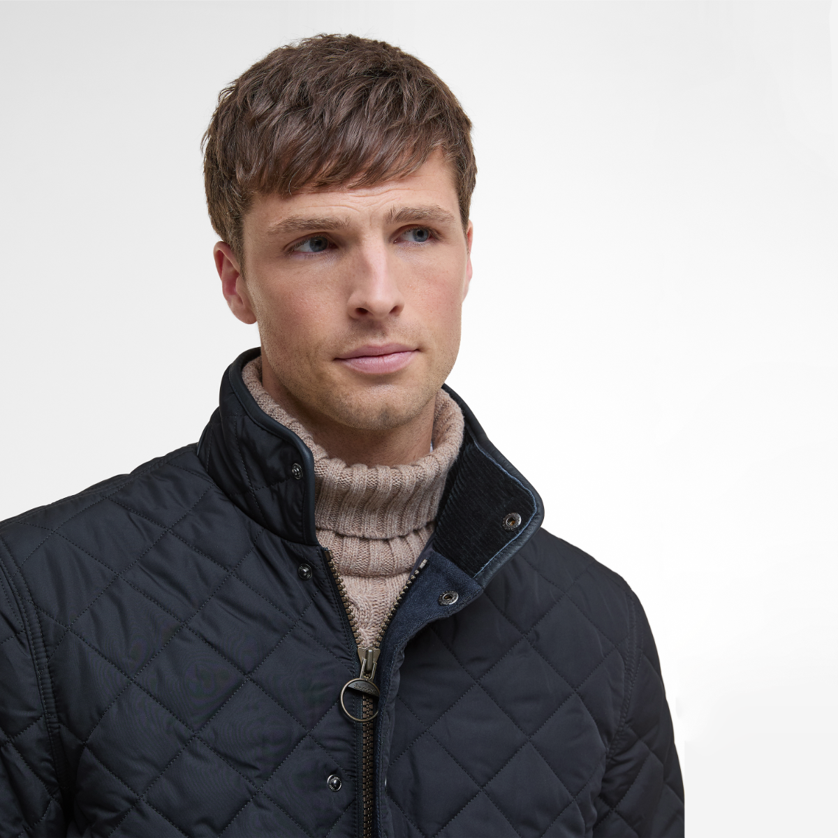 Close-up of Barbour corduroy collar and branded zip