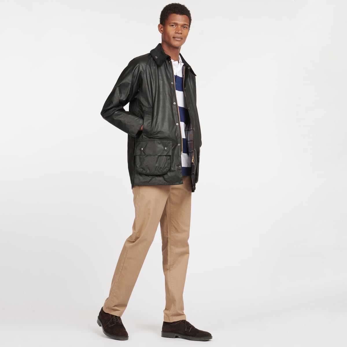 Man wearing Barbour Beaufort Wax Jacket in black