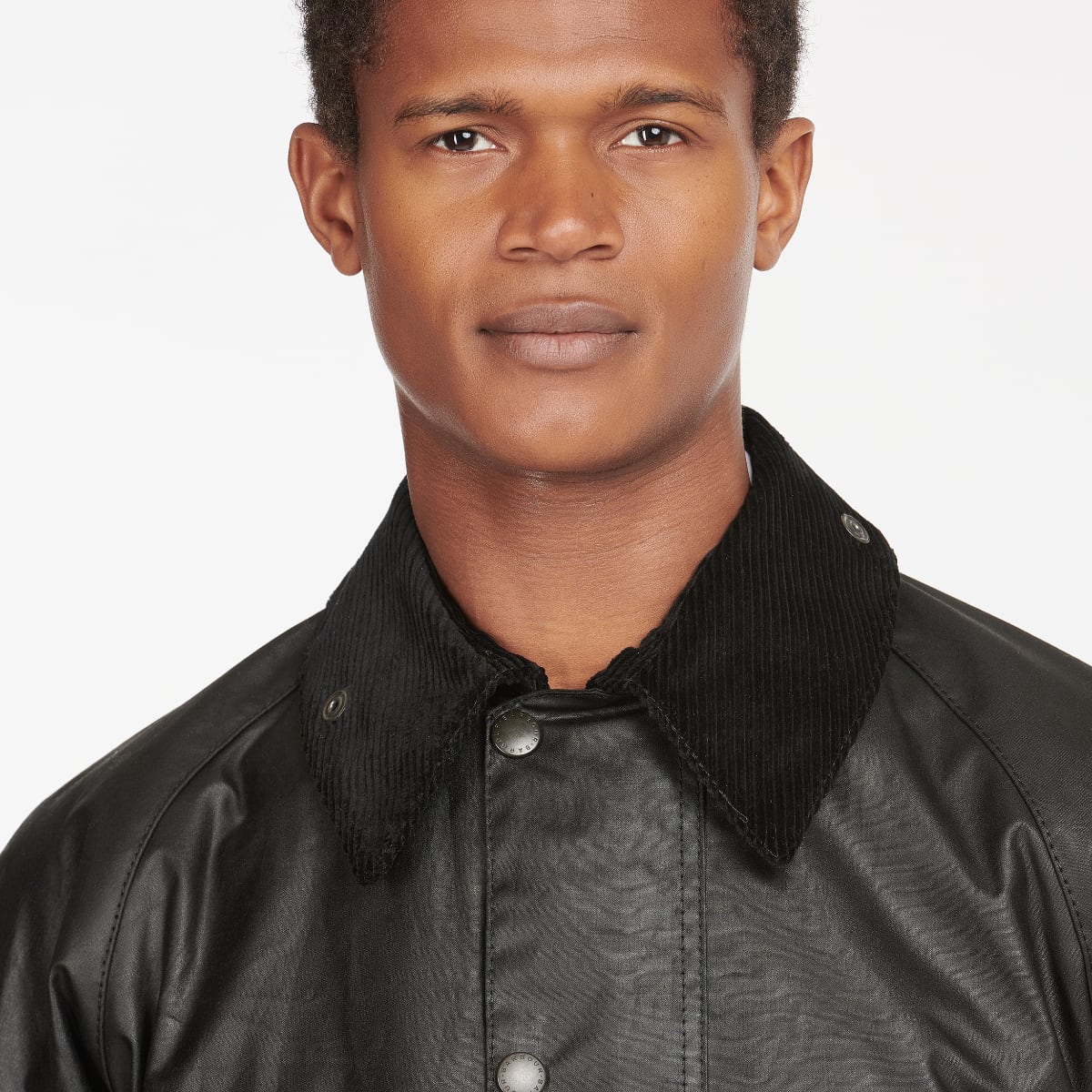 Close-up of corduroy collar and tartan lining on Barbour Beaufort jacket