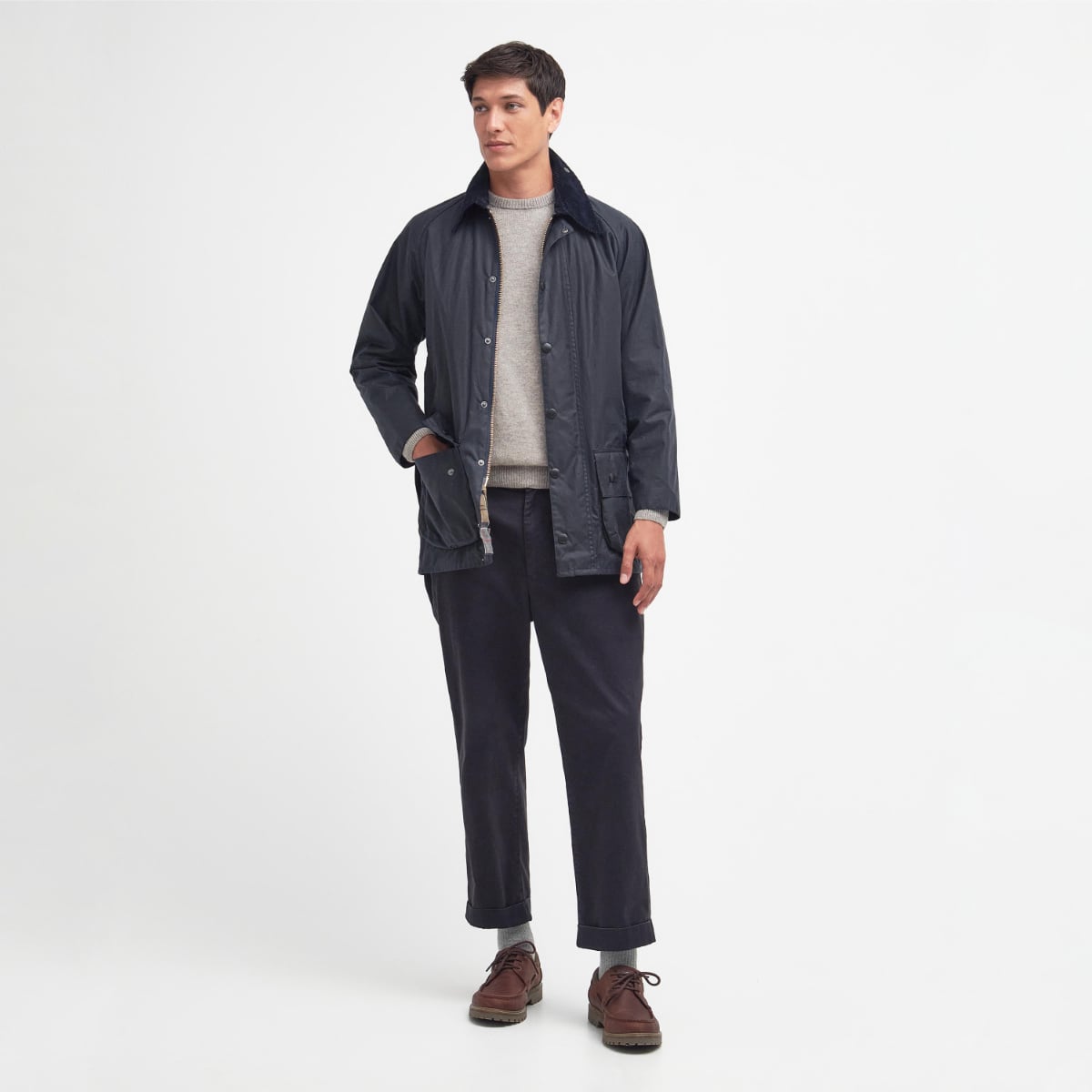 Man wearing Barbour Beaufort Wax Jacket in navy