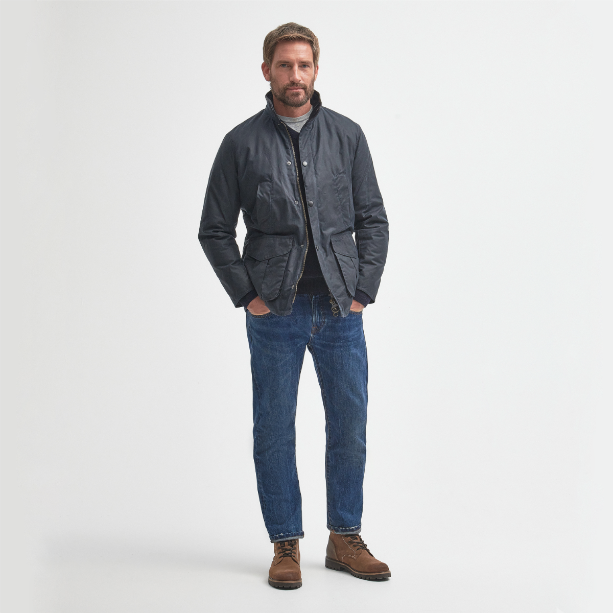 Barbour Hereford wax jacket front view in navy on model full height