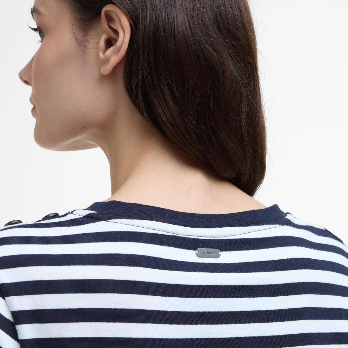 Back view of navy and white striped Barbour Ferryside top with metal plaque on the upper back.