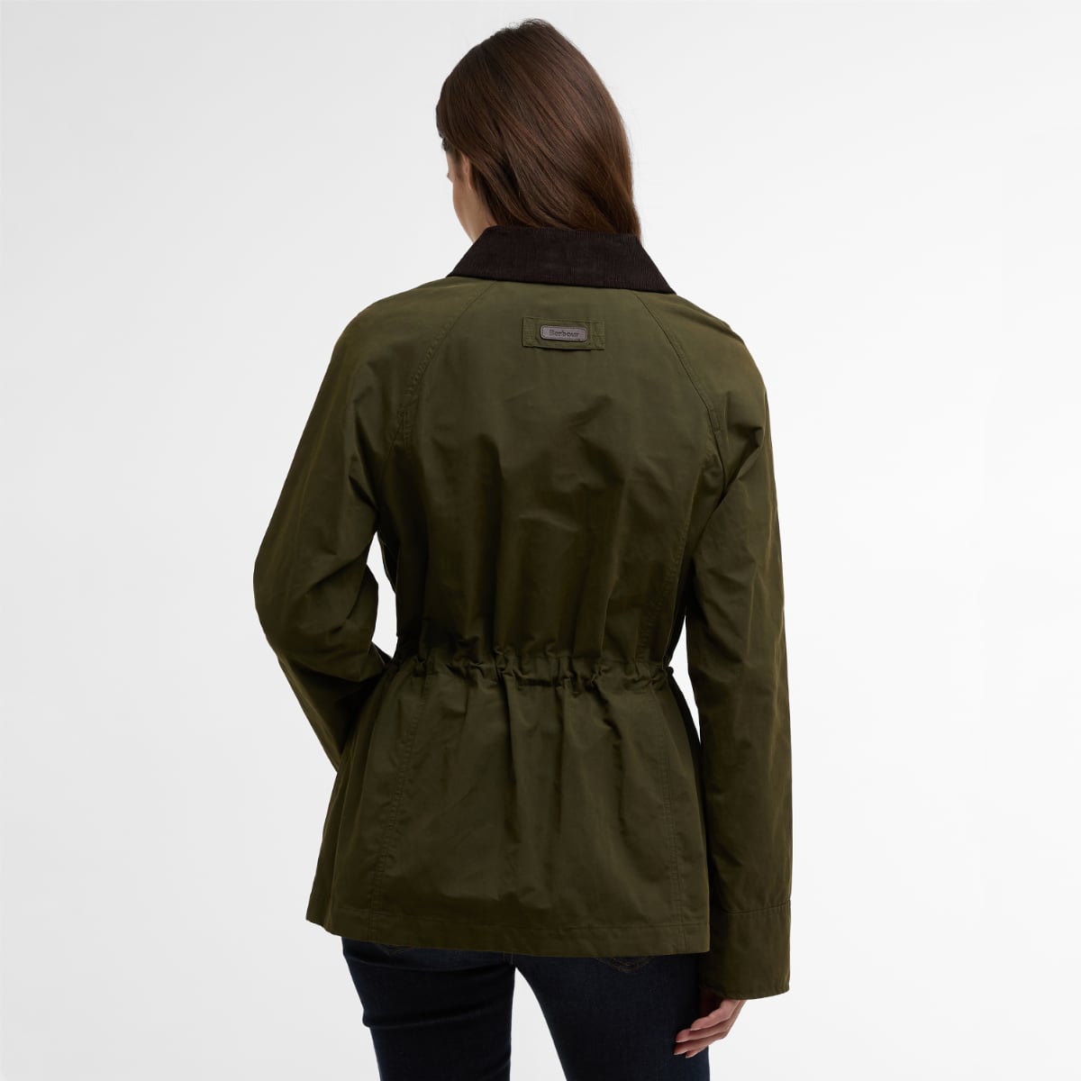 Back view of olive Barbour Croton jacket on a model showing a dark collar and gathered waist