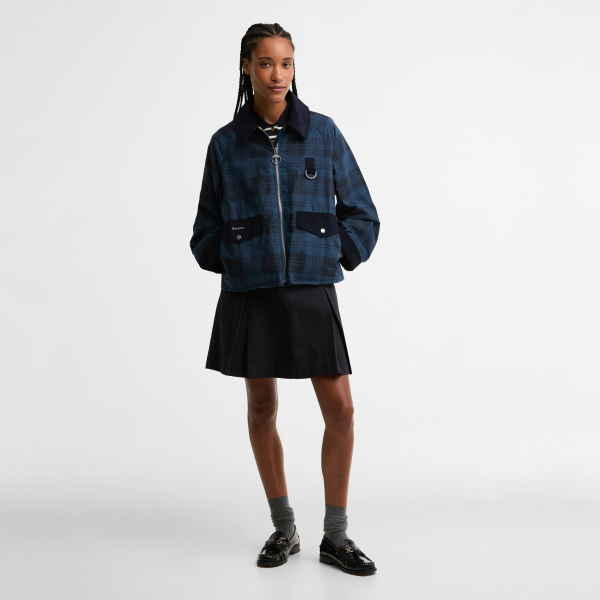 Model wearing Barbour Baiton Casual jacket in Weathered Marine plaid with zip front and patch pockets.