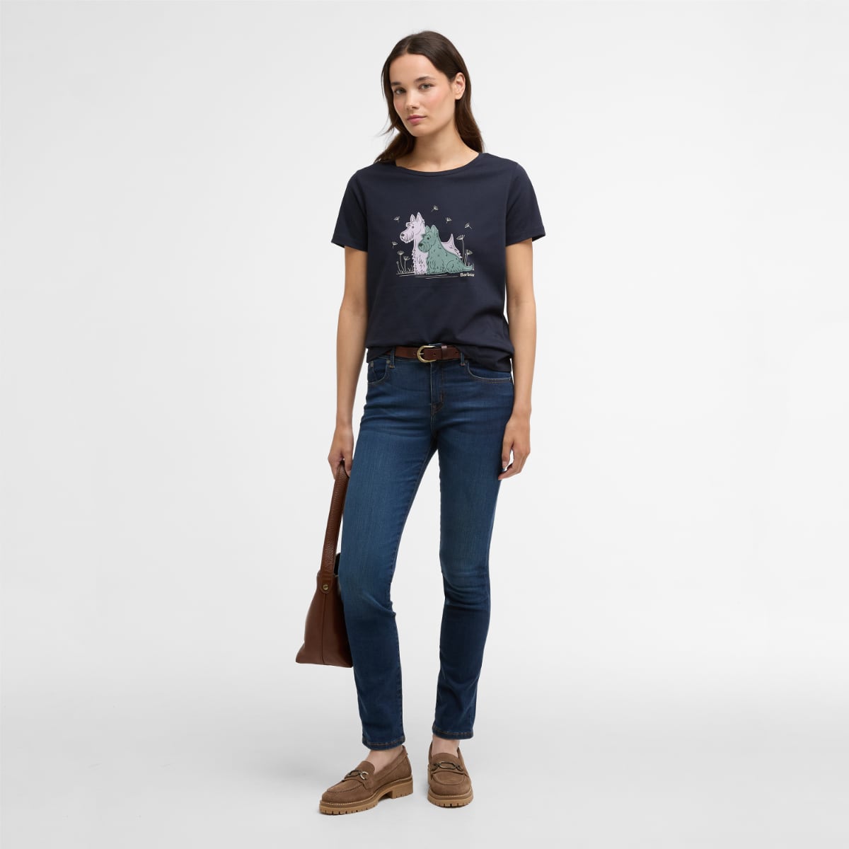 Woman wearing navy Barbour Clover T Shirt with pastel dog illustration on the front