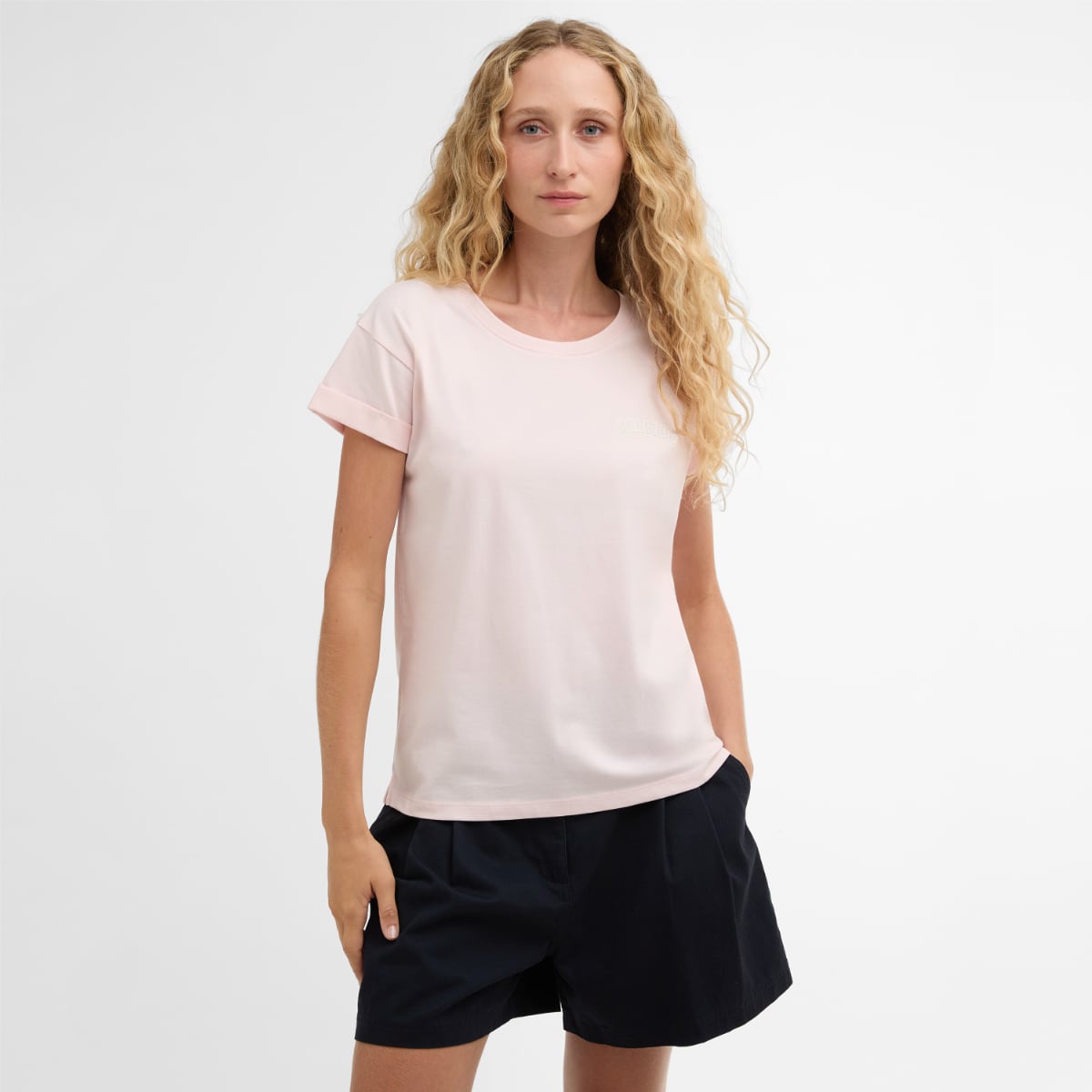 Model wearing a pale pink Barbour Bede T Shirt.