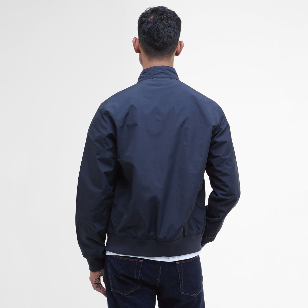 Back view of Barbour Royston navy jacket on a model showing the collar and gathered hem