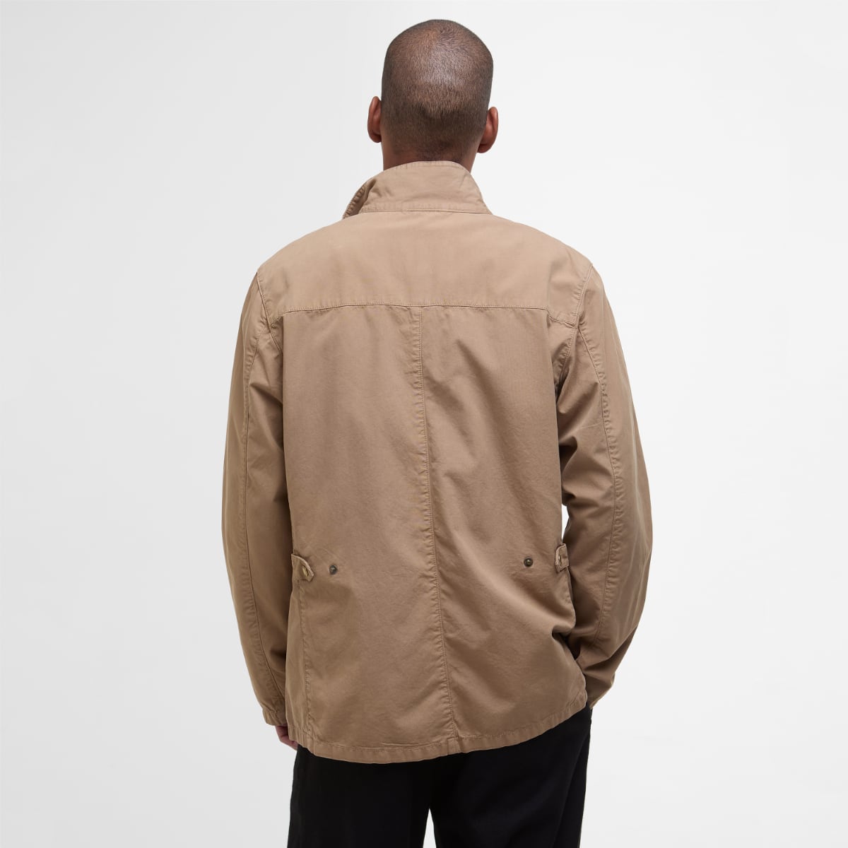 Back view of Barbour Ogston men's casual jacket in stone worn by a model