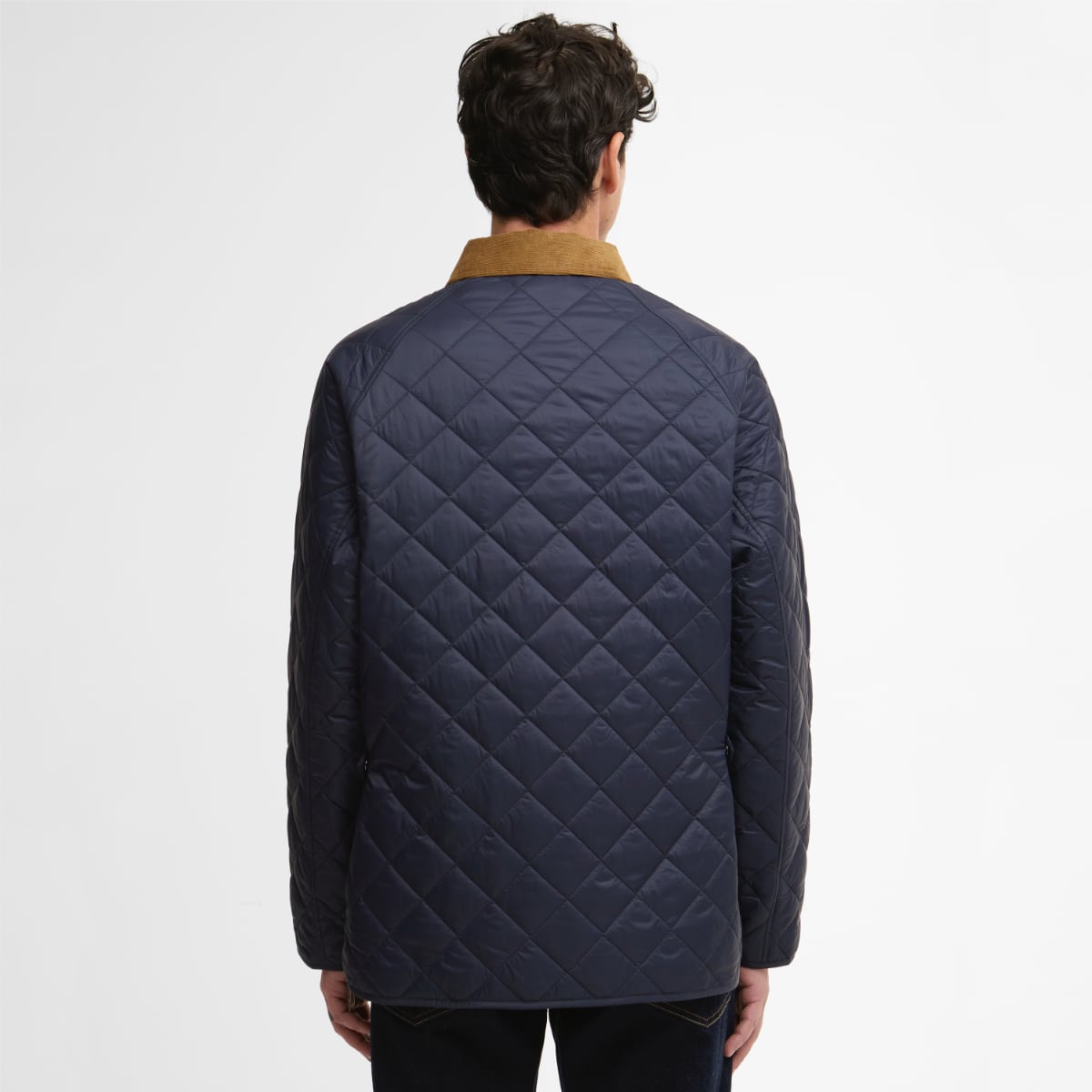 Back view of a navy quilted Barbour City Bedale jacket with a tan corduroy collar