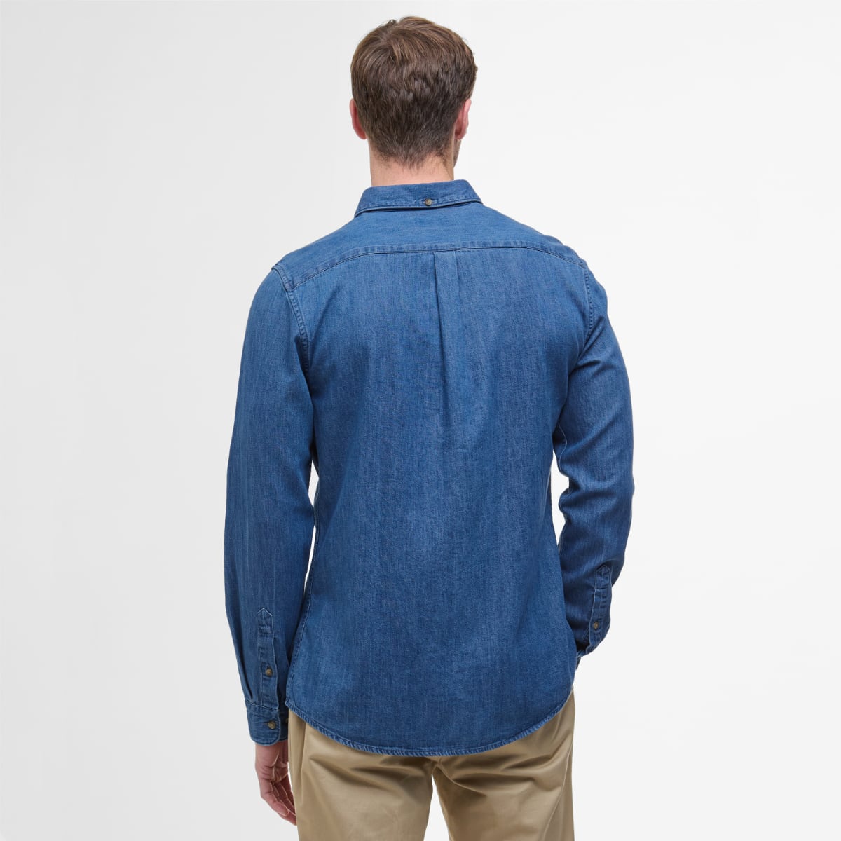 Back view of blue Barbour Crest chambray long sleeve tailored shirt on a male model