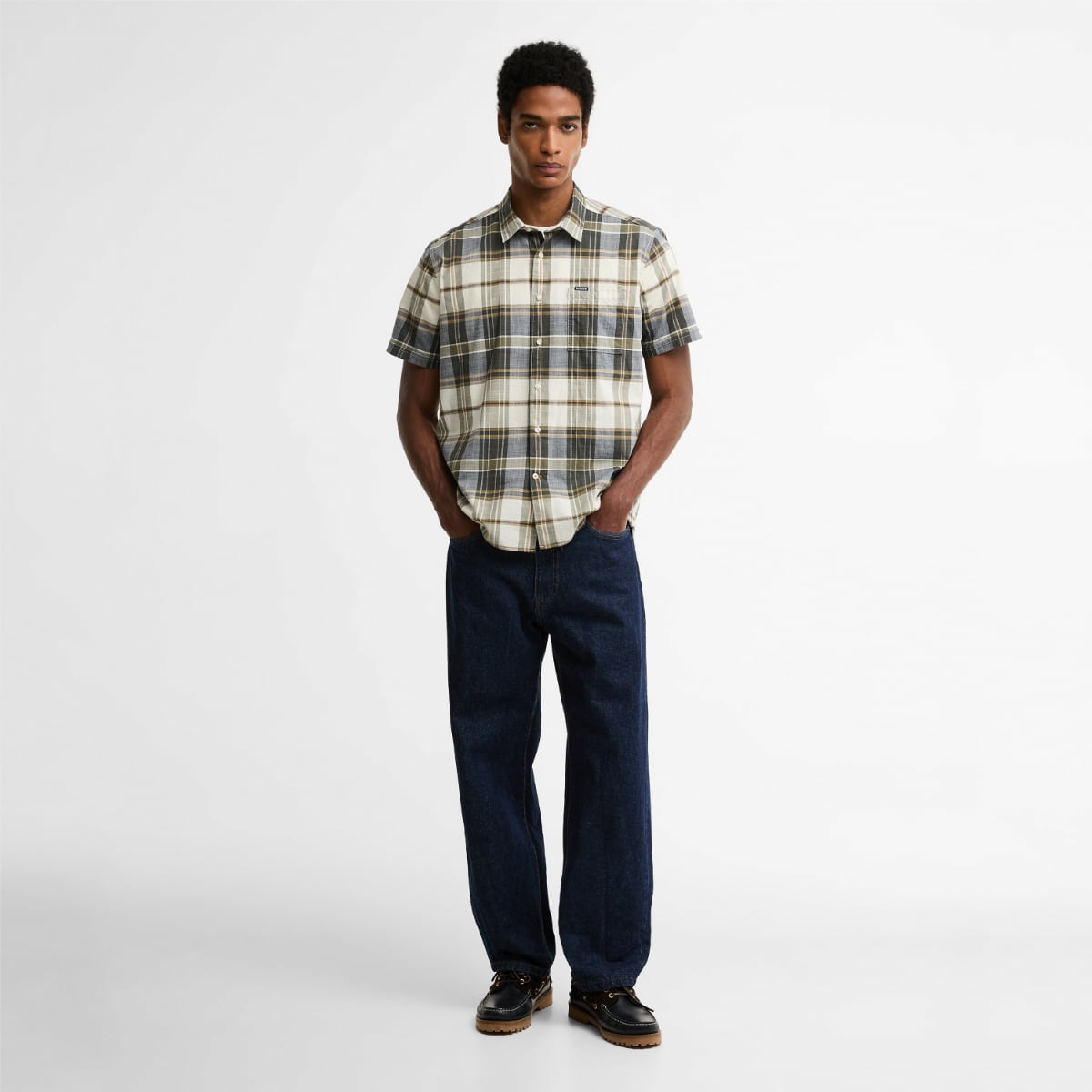 Barbour Grassbeach tartan short-sleeve relaxed fit shirt in whisper white worn by model with hands in pockets
