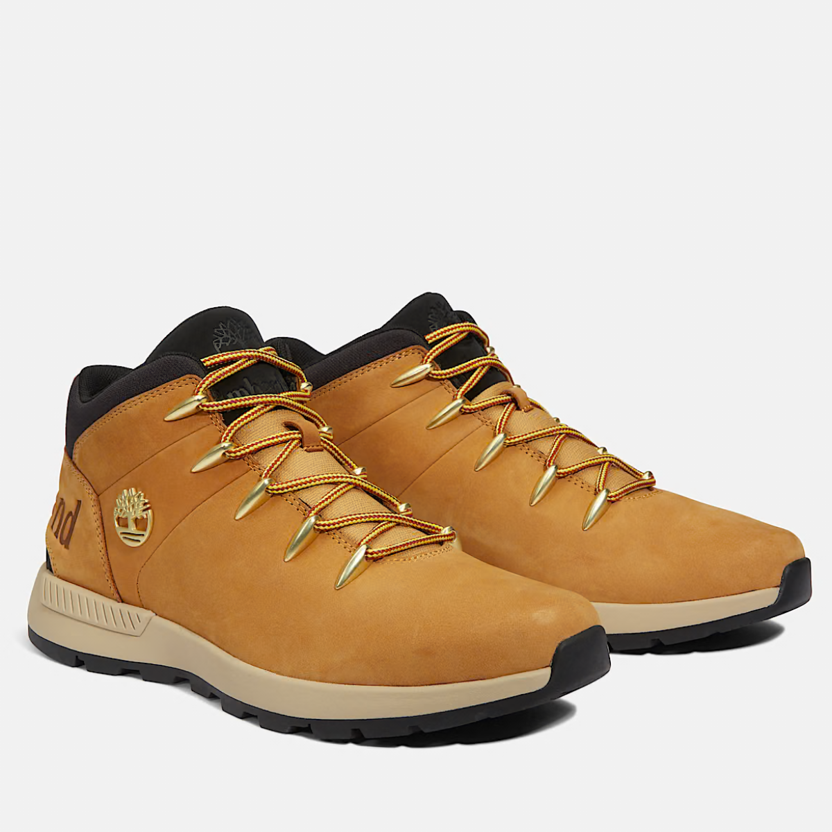 A pair of Timberland Sprint Trekker Mid Men's Boots in wheat nubuck color featuring lace-up closure and a mid-height design.