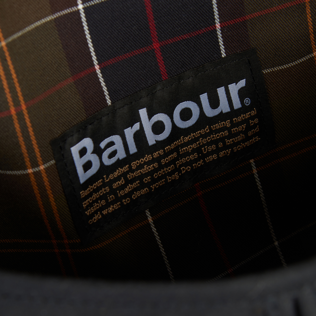 Inside view of Barbour Tarras Bag showing Barbour Tartan Lining and Storage Compartments