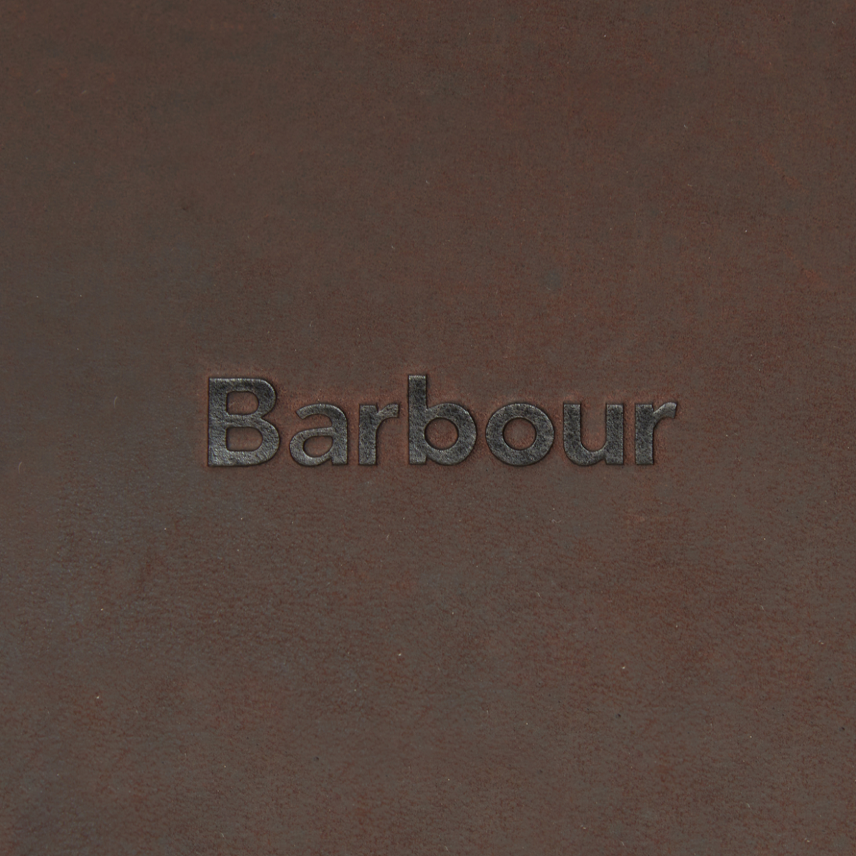 Close-up of Barbour Wax Tarras Bag Leather Trim and logo