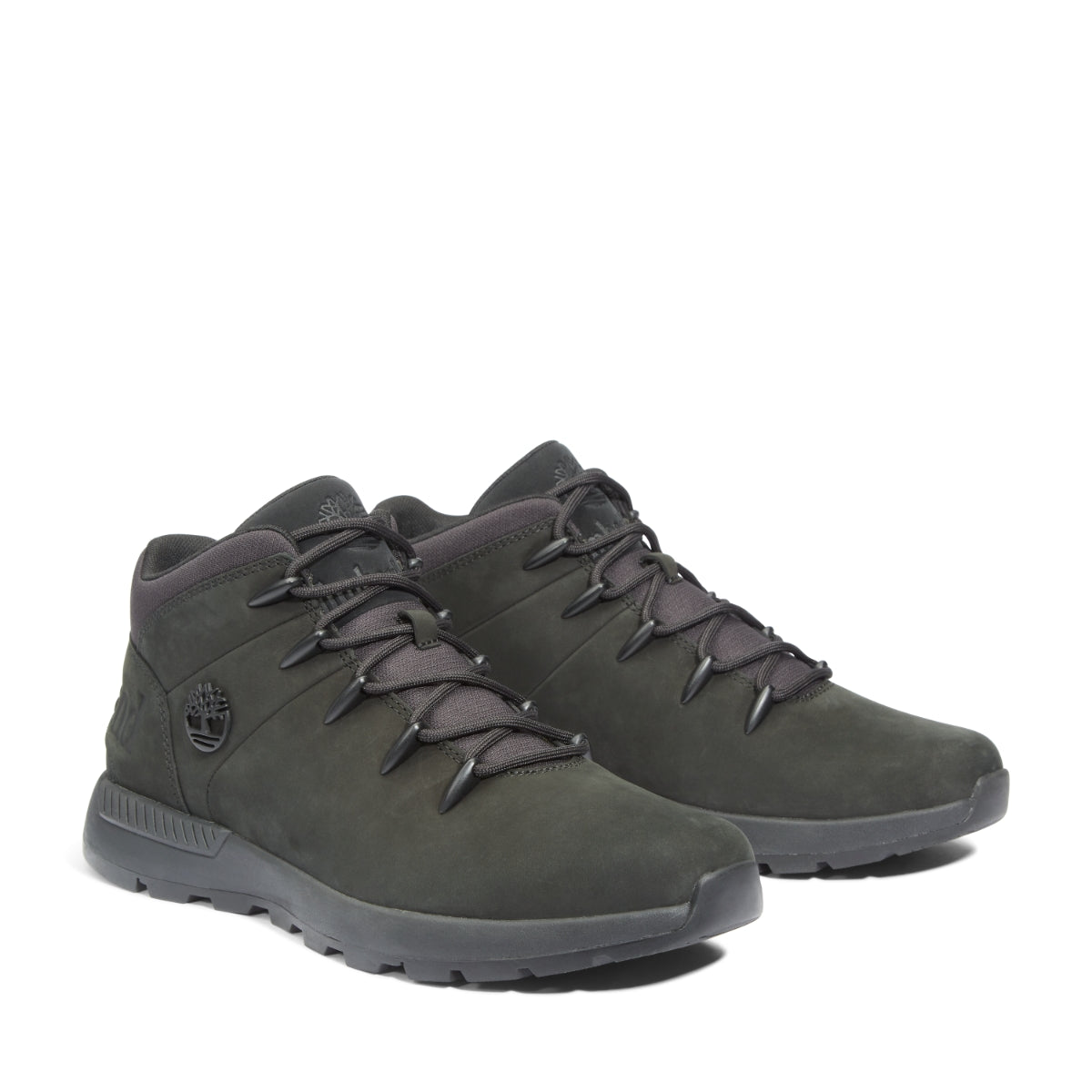 A pair of Timberland Sprint Trekker Mid Men's Boots in black color, featuring a lace-up closure and a low heel.