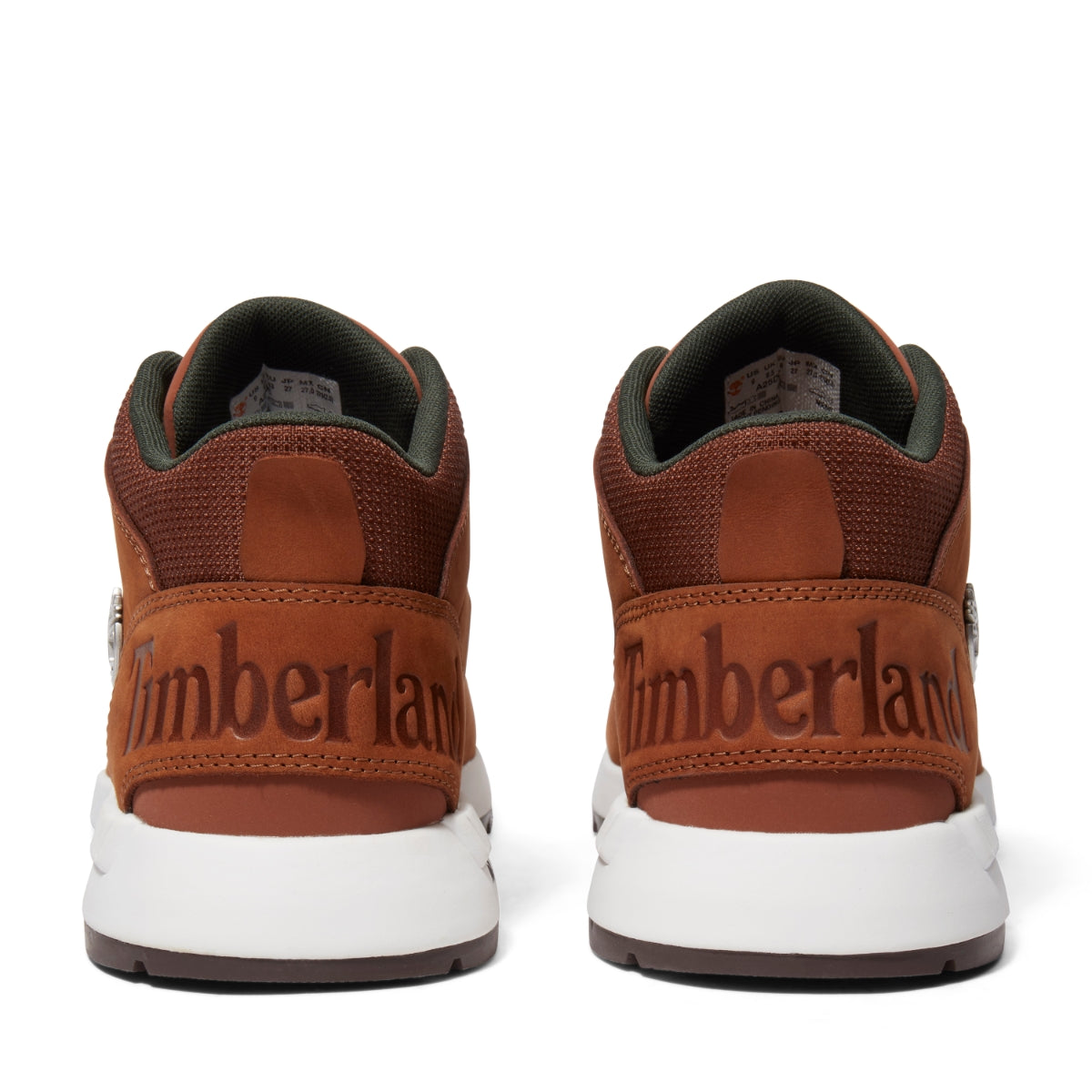 A pair of brown Timberland Sprint Trekker Mid Men's Boots with lace-up closure, featuring a leather upper, fabric lining, and rubber outsoles. Rear view.