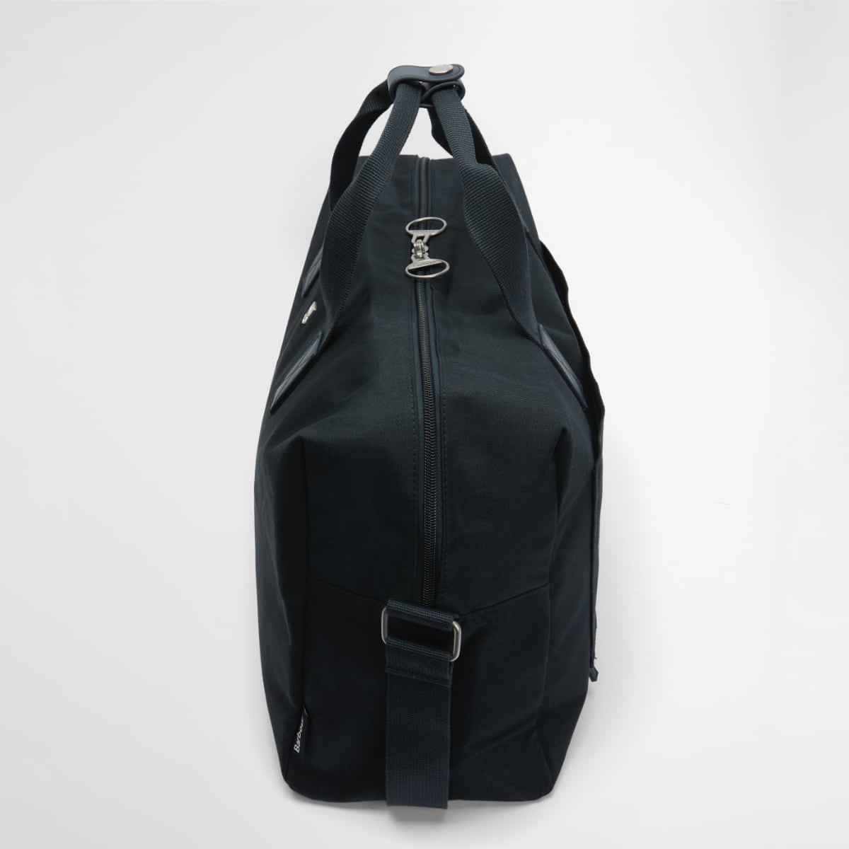 Barbour Cascade Flight Bag navy side view with dual top handles and vertical zipper