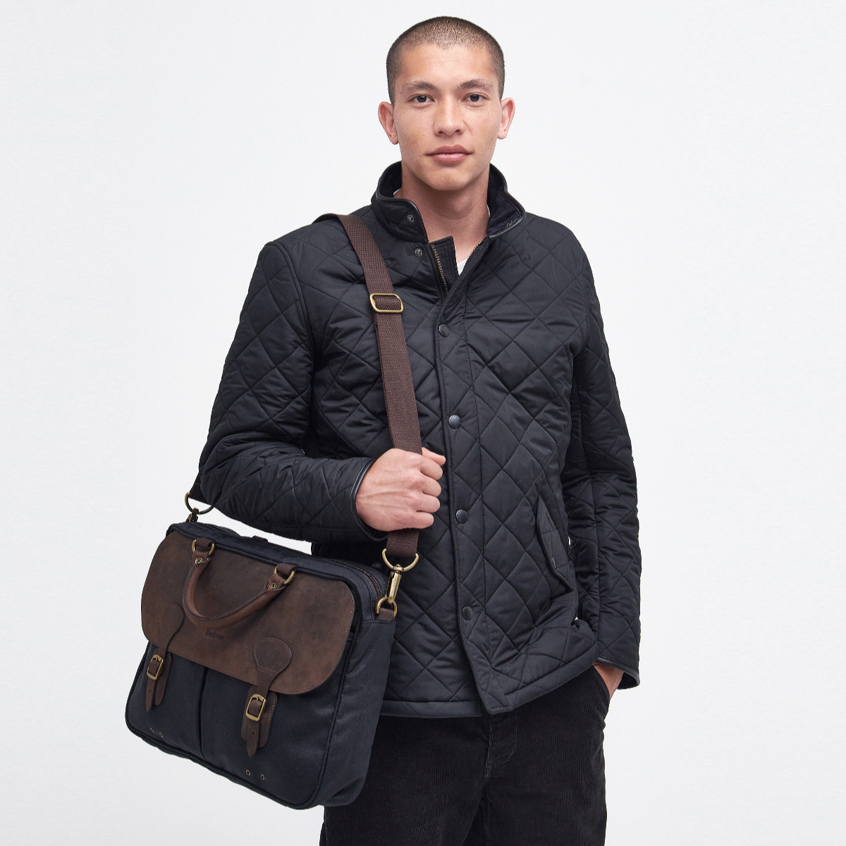 Barbour Navy Wax Leather Briefcase with adjustable shoulder strap and brass hardware – angled front view