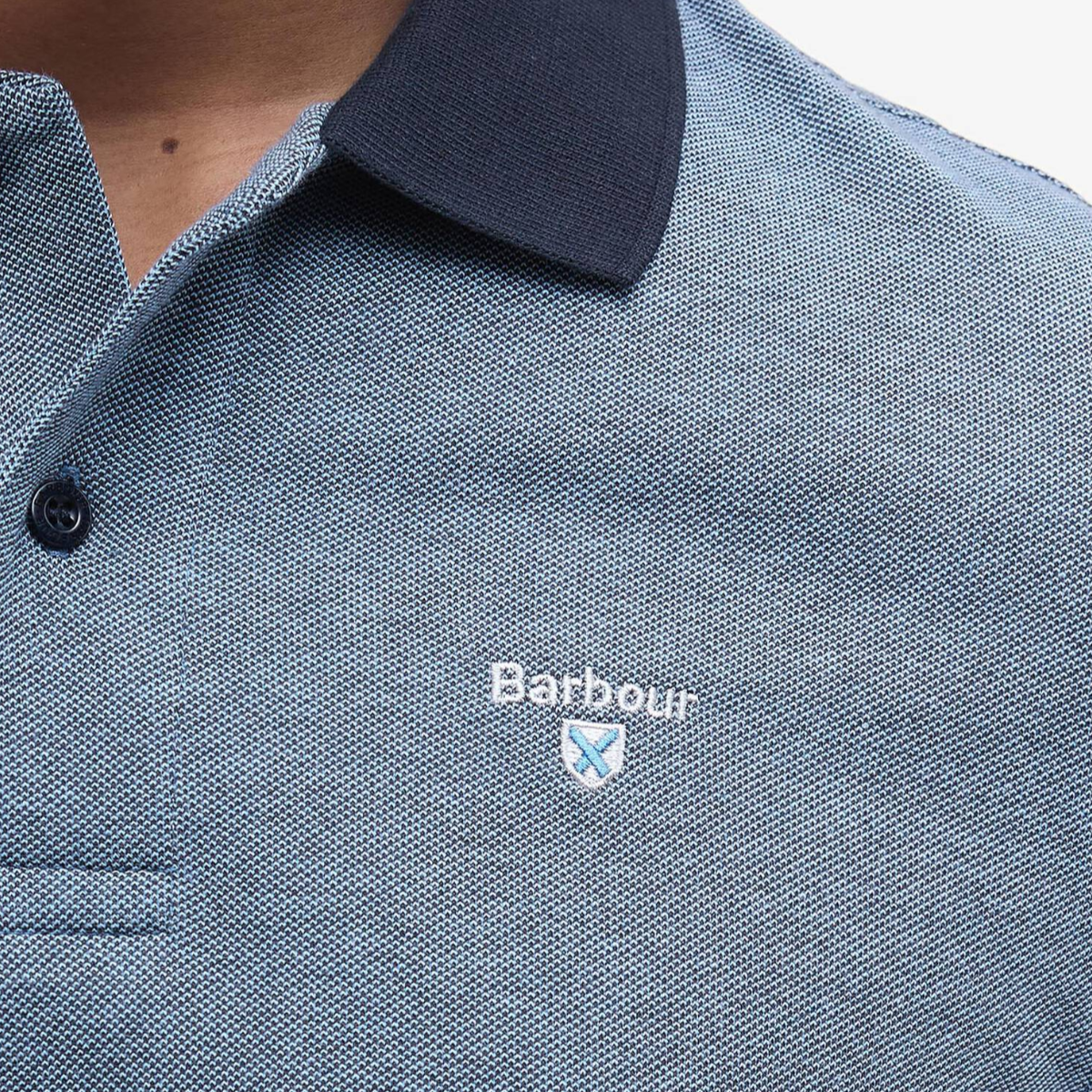 Close-up of textured Barbour Essential Sports Mix polo in Classic Navy with navy collar and small embroidered logo