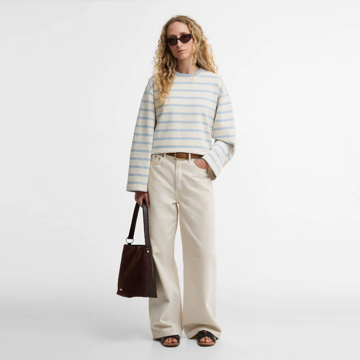 Barbour Fawley striped sweatshirt in original ecru and celestial blue worn with cream wide-leg pants and brown tote
