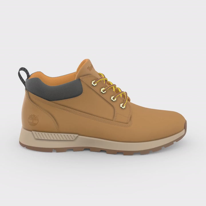 Video of A pair of Timberland Killington Trekker Low Chukka Men's Boots in wheat color, featuring a lace-up closure, with the Timberland logo visible on the heel outer side.